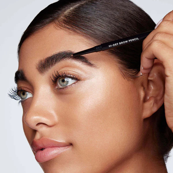 Begin applying Hi-Def Brow Pencil to the fullest part of your brow, slowly adding definition and filling in sparse areas using short strokes.