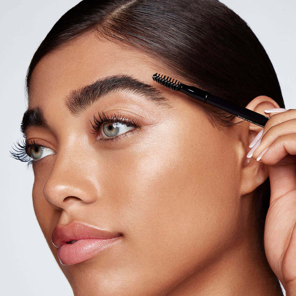 Use the brush side of pencil to add shape and gently blend the color through brows.  Tip: Use in tandem with Hi-Def Brow Gel to lock in your look. 